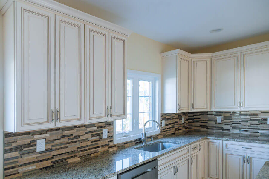 Remodelled kitchen with a large island, stone worktops and pendant lighting