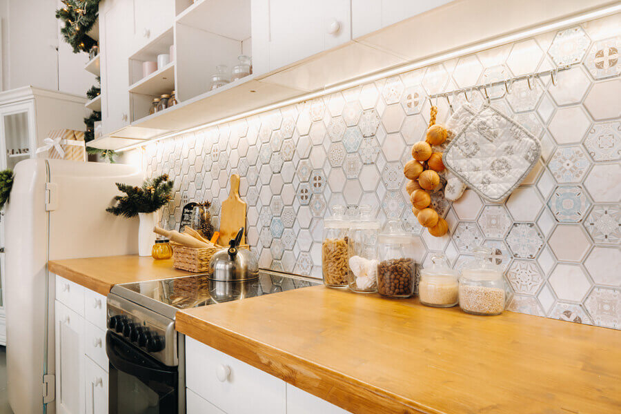 Modern kitchen with a long stone countertop and bar seating